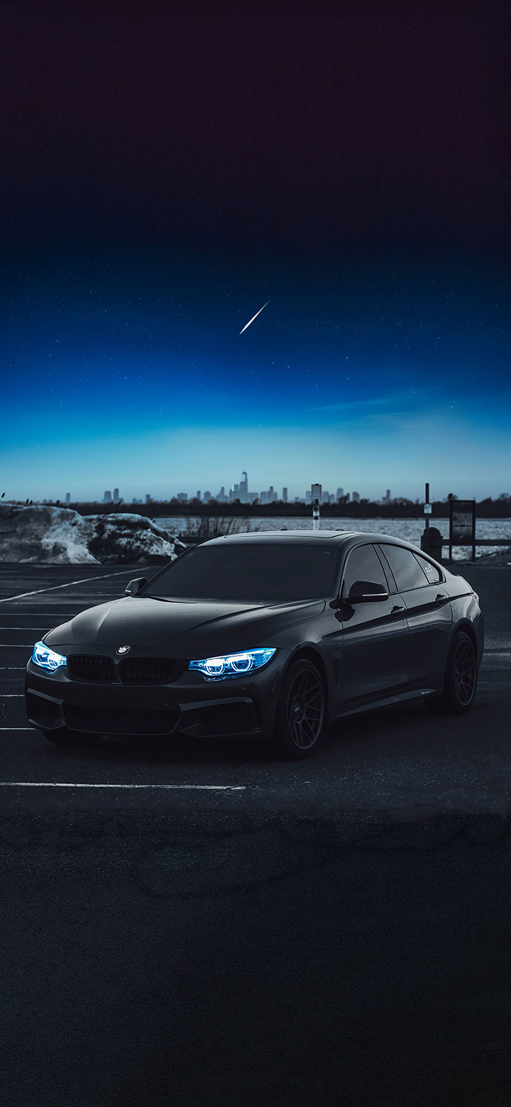 wallpaper of Black BMW Under Moonlight