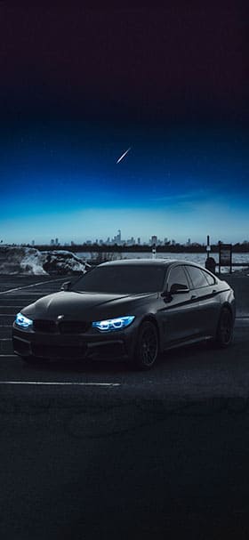 Phone Wallpaper of Black BMW Under Moonlight