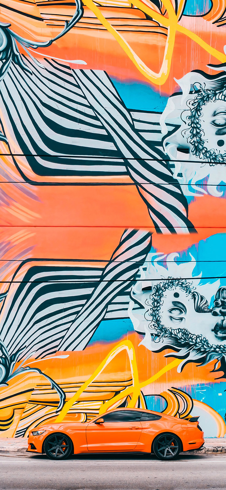wallpaper of Cool Orange Mustang Near Graffiti Art