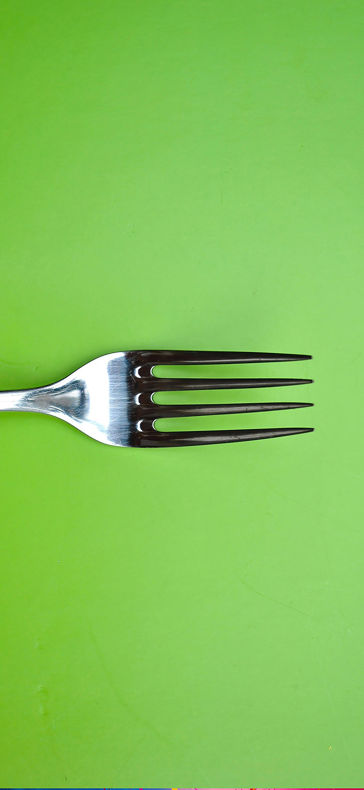 wallpaper of Silver Fork On A Green Background