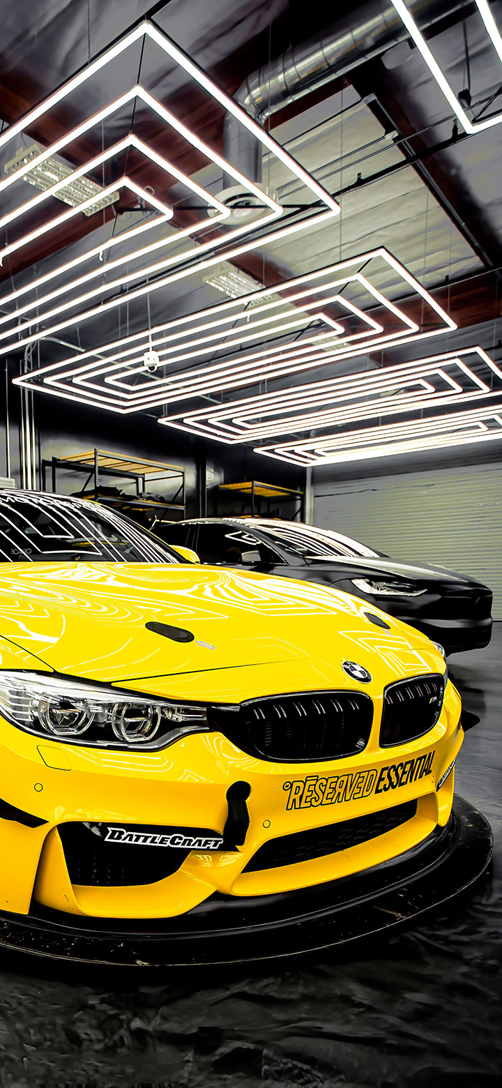 wallpaper of Yellow BMW Inside Garage