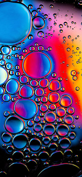 cool air bubbles trapped in colorful liquid phone wallpaper