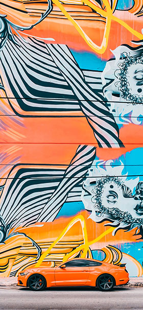 Phone Wallpaper of Cool Orange Mustang Near Graffiti Art