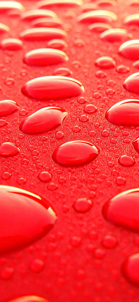 Phone Wallpaper of Cool Water Droplets On Red Surface