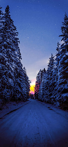 Phone Wallpaper Of Dark Road Covered With Snow During Winter