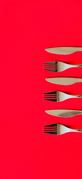 Phone Wallpaper Of Silver Cutlery On A Red Table