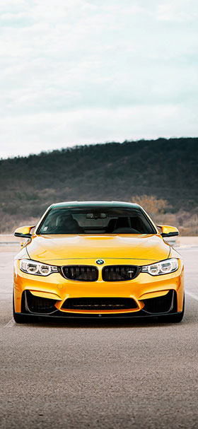 Phone Wallpaper of Yellow BMW Sport Car On The Road