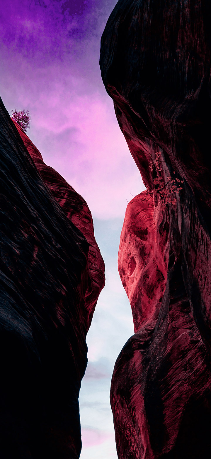 wallpaper of glittering night sky over a rocky cavern