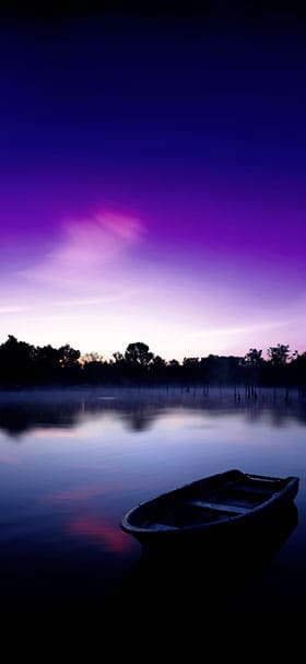 Phone wallpaper of Small boat floating on a dark lake