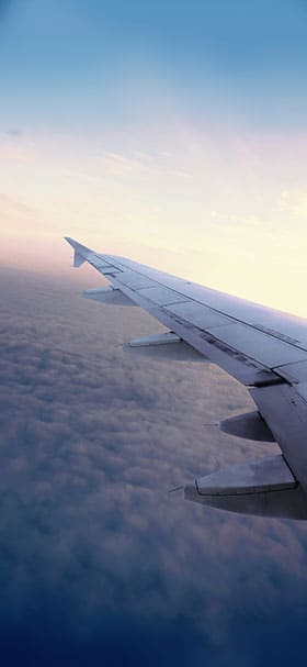 Phone wallpaper of Airplane wing above aesthetic clouds