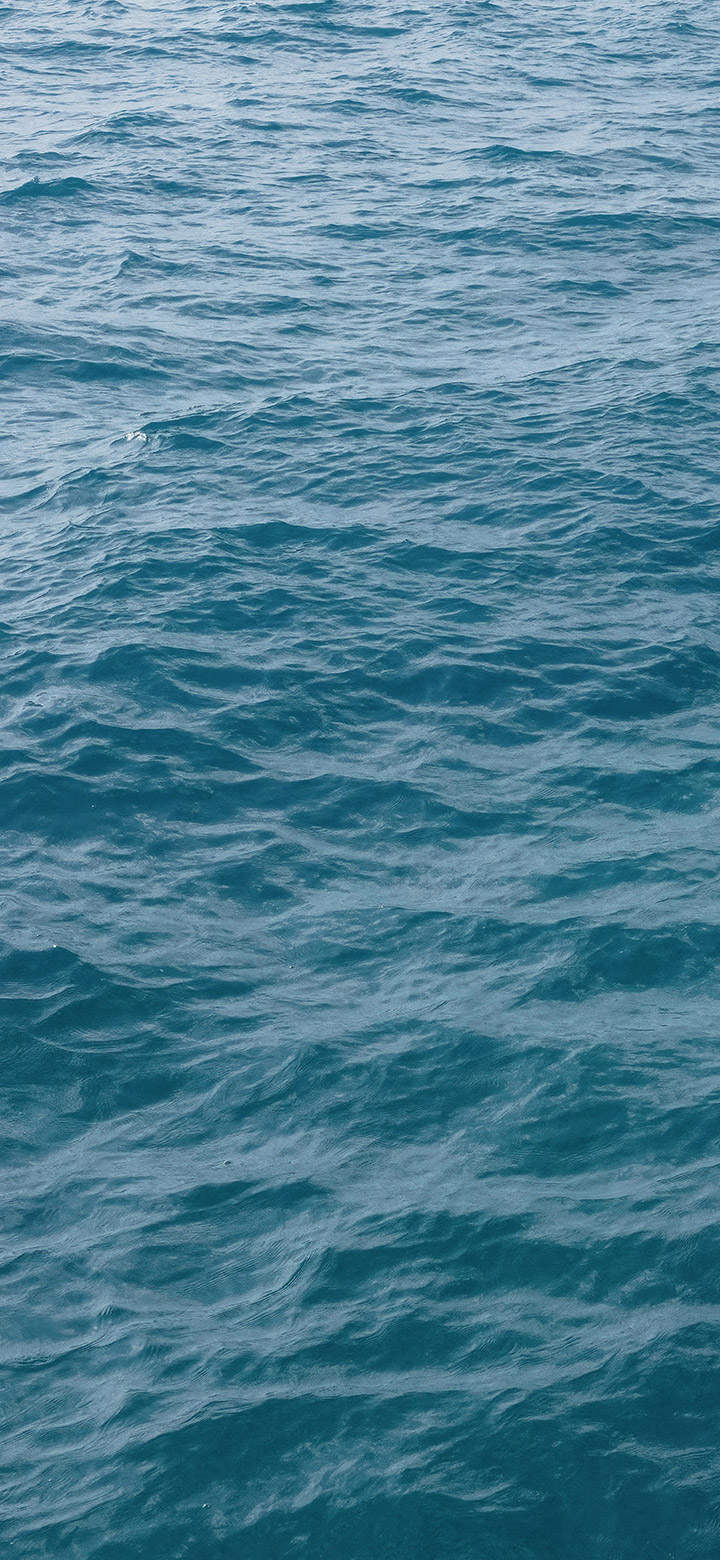 wallpaper of small waves of ocean water