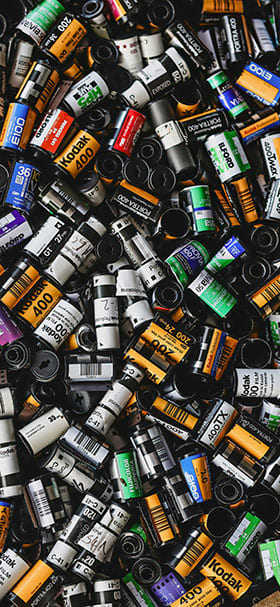 Phone Wallpaper of Pile of photographic film rolls