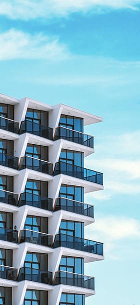 Phone Wallpaper of Tall building with balconies and blue windows