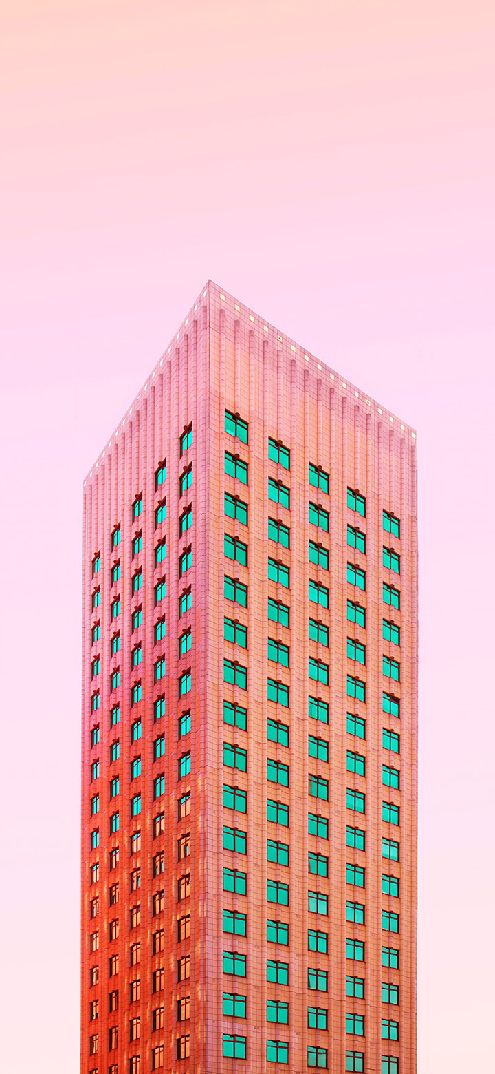 wallpaper of Tall Pink Building With Tiny Windows