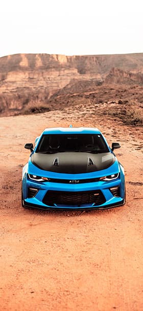 Phone Wallpaper of Blue Camaro In The Middle Of Desert