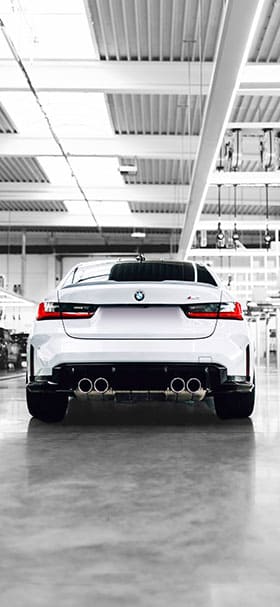 phone wallpaper of white bmw parked inside a warehouse