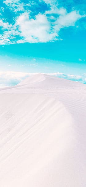 iPhone wallpaper of white sand dunes under a clear sky