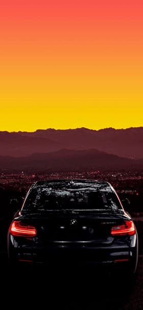 Phone Wallpaper Of Cool BMW On Road At Sunset