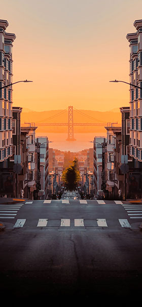 Lock Screen Wallpaper of A Bridge And A City Street At Sunset